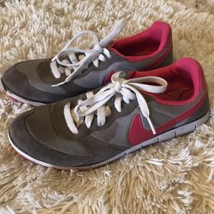 Womens Pink and Grey Nikes running shoes size 8